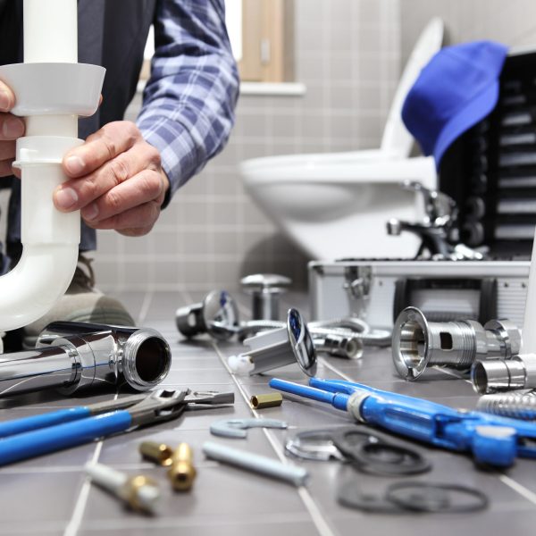 Plumber,At,Work,In,A,Bathroom,,Plumbing,Repair,Service,,Assemble